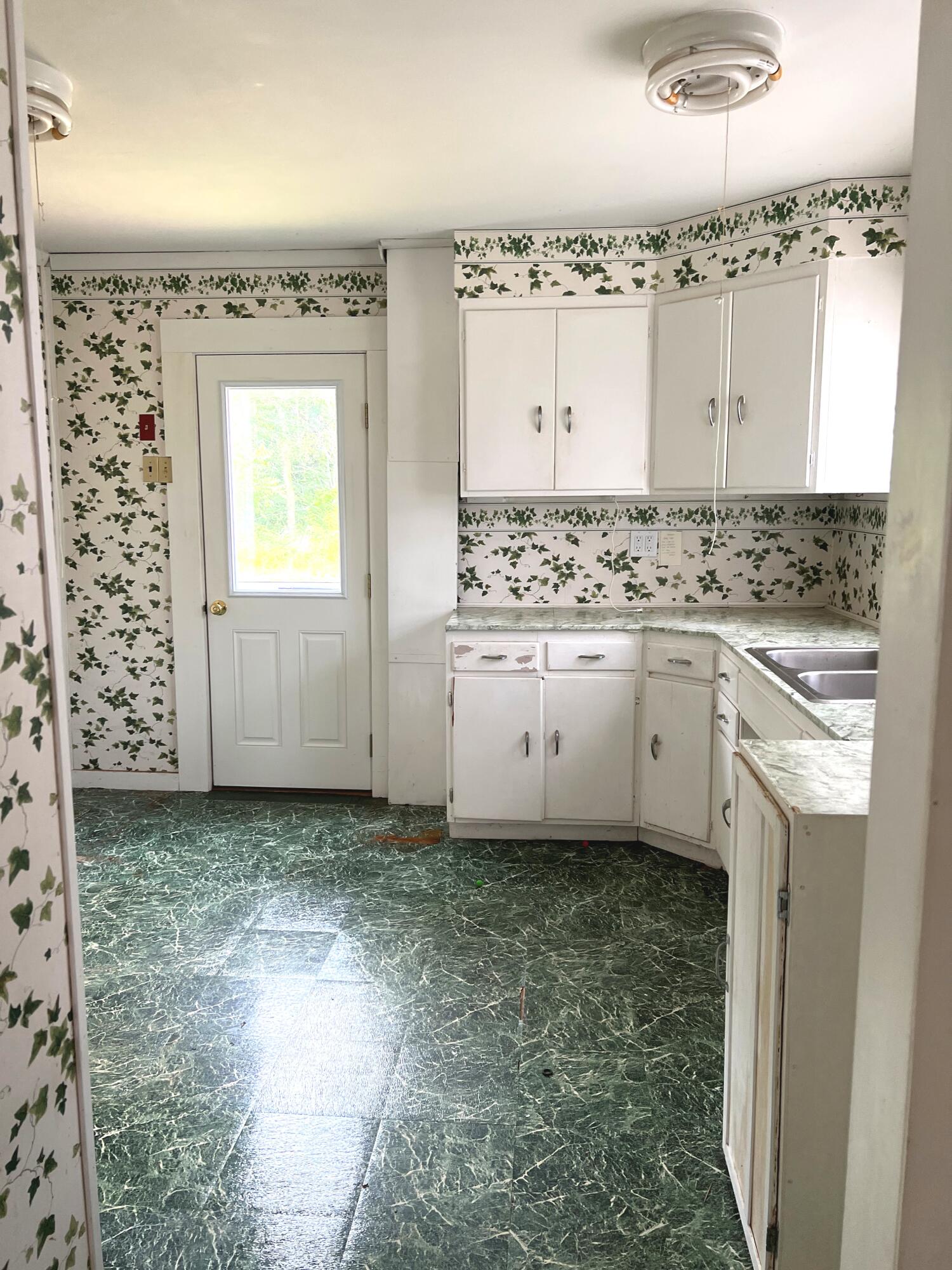 13 Andrews Road Vineyard Haven, MA 02568 - Photo 3 of 20 a bathroom with a granite countertop sink a toilet and mirror