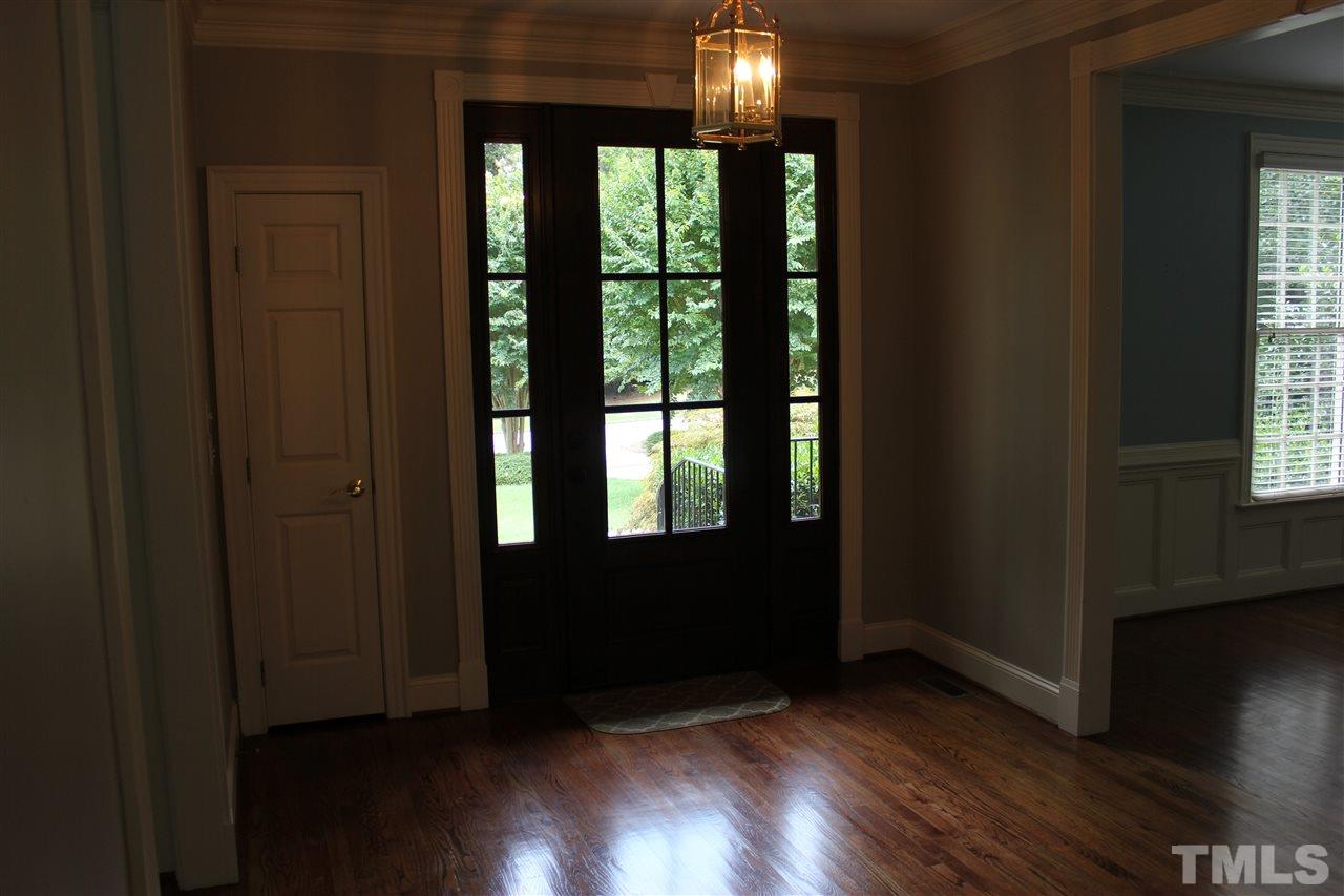 11020 Brass Kettle Road Raleigh, NC 27614 - Photo 2 of 25 Wide Foyer with glass front door, sidelights and hardwood floors.
