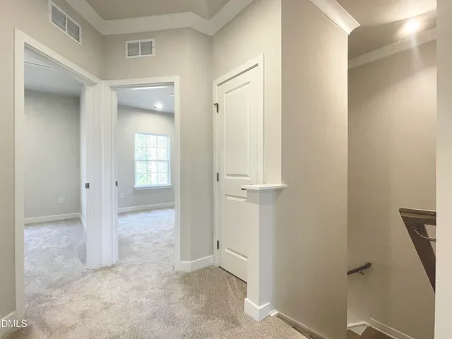 an empty room with closet area