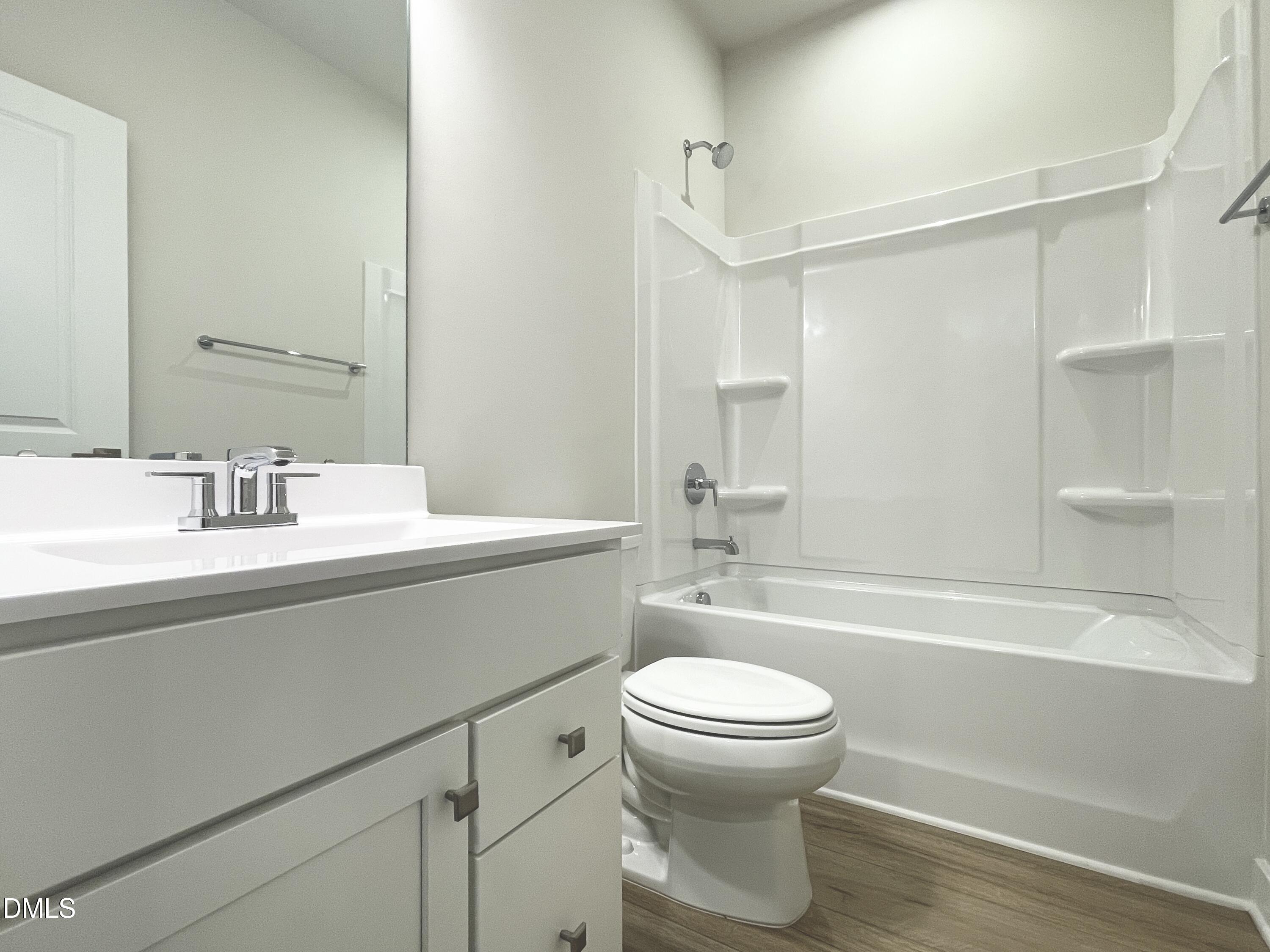2305 Pitchfork Lane Durham, NC 27713 - Photo 19 of 27 a bathroom with a sink toilet and shower