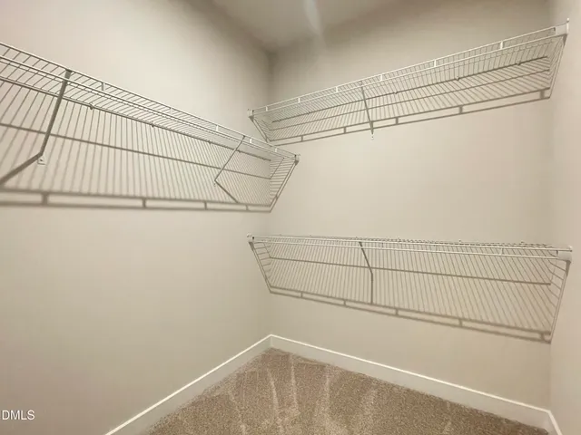 a bathroom with a double vanity sink mirror and a bathtub