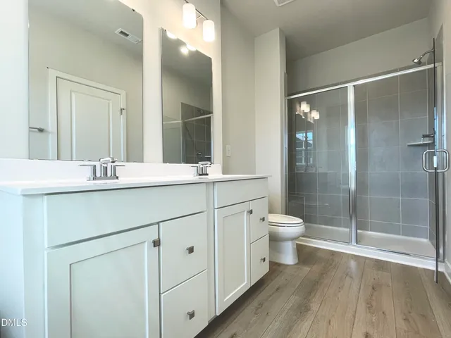 a room with a sink and a mirror