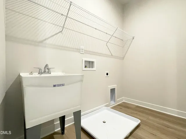 a front view of a building with a garden and space