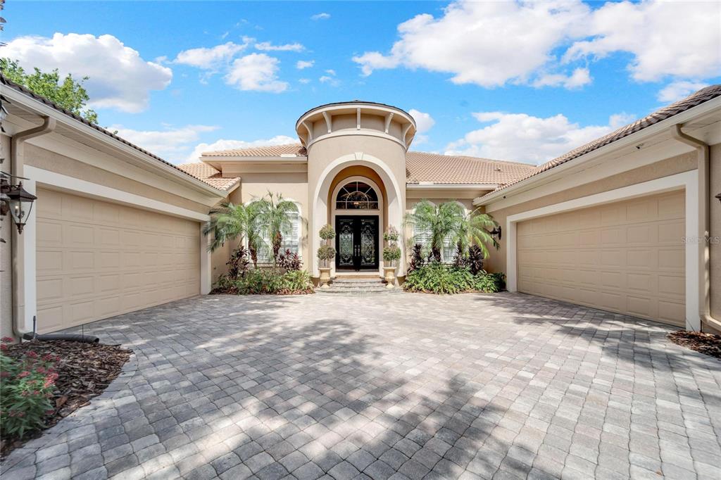 15101 Kestrelglen Way Lithia, FL 33547 - Photo 17 of 75 a front view of a house with a garden