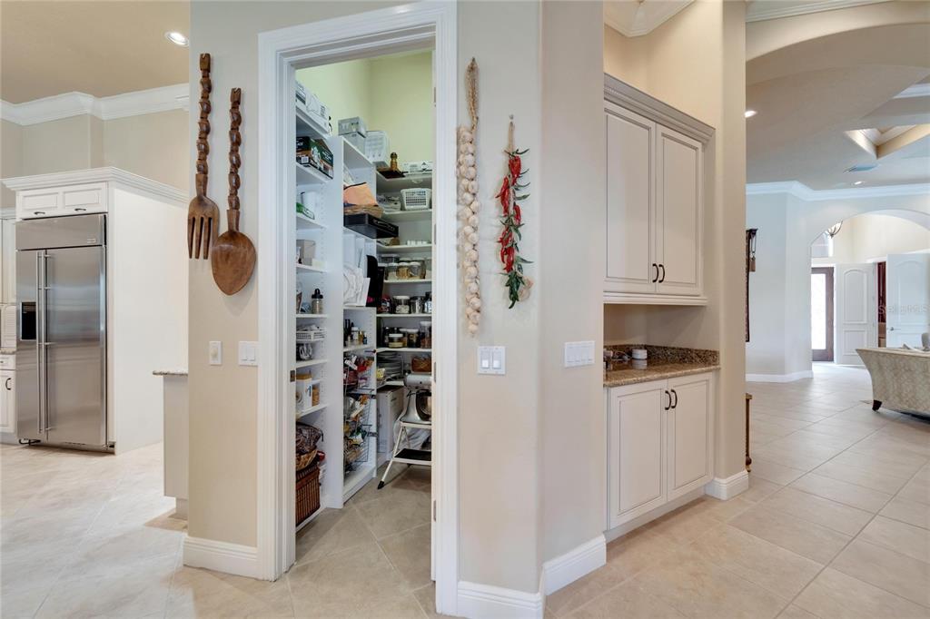 15101 Kestrelglen Way Lithia, FL 33547 - Photo 29 of 75 a kitchen with white cabinets and window
