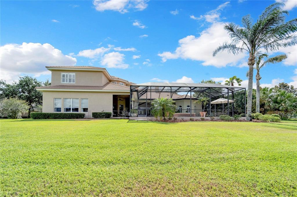 15101 Kestrelglen Way Lithia, FL 33547 - Photo 3 of 75 a view of a house with swimming pool and a yard