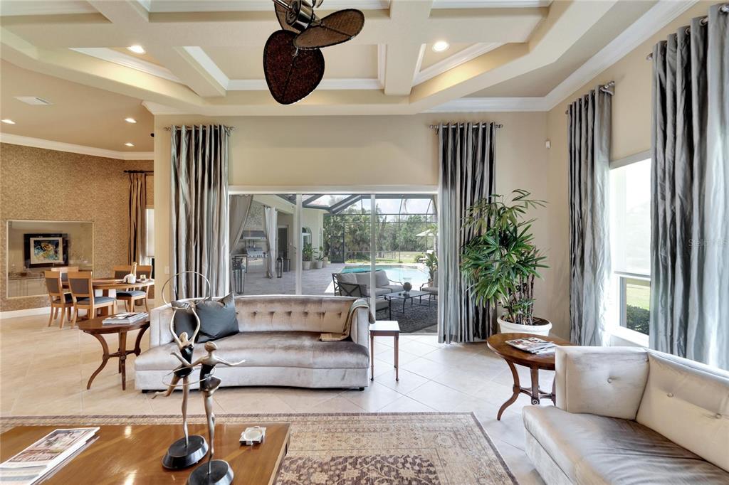 15101 Kestrelglen Way Lithia, FL 33547 - Photo 32 of 75 a living room with furniture and a large window