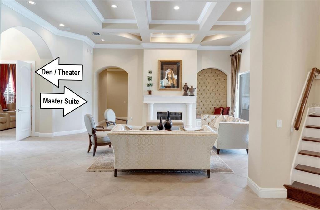 15101 Kestrelglen Way Lithia, FL 33547 - Photo 36 of 75 a living room with fireplace furniture and a large window