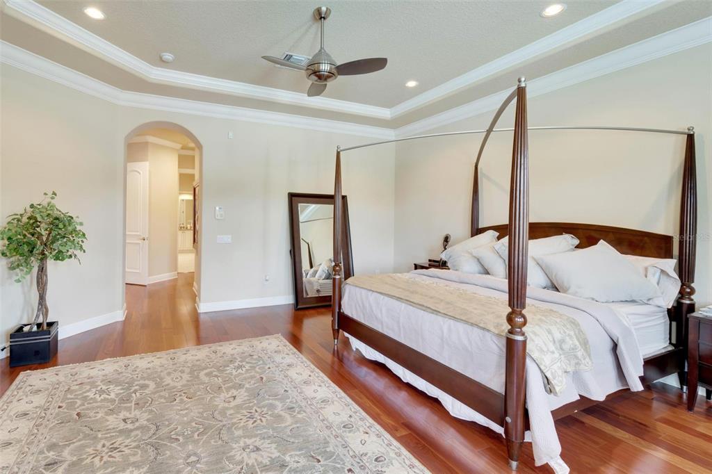 15101 Kestrelglen Way Lithia, FL 33547 - Photo 41 of 75 a bedroom with a bed and a large mirror