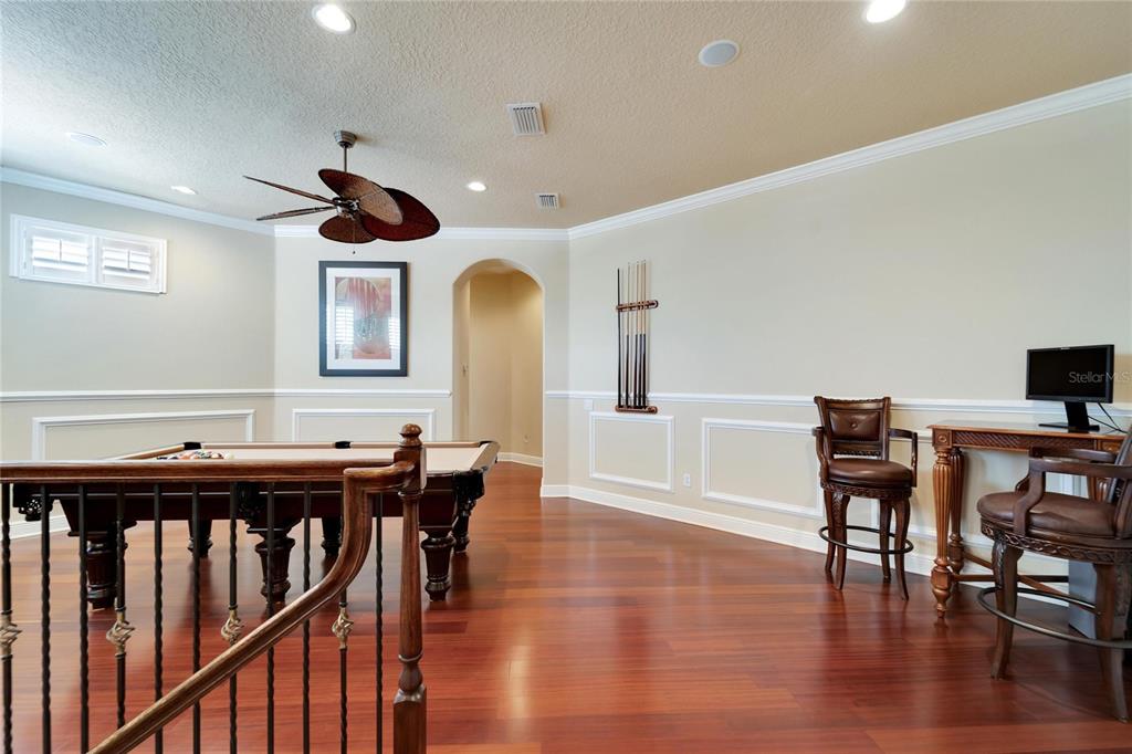 15101 Kestrelglen Way Lithia, FL 33547 - Photo 47 of 75 a view of a dining room with furniture and wooden floor
