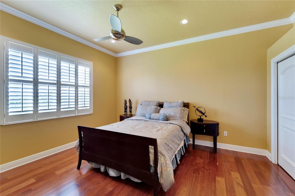 15101 Kestrelglen Way Lithia, FL 33547 - Photo 49 of 75 a bedroom with a bed and a table in it