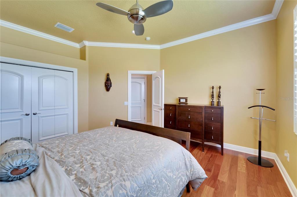 15101 Kestrelglen Way Lithia, FL 33547 - Photo 50 of 75 a bedroom with a bed and a dresser