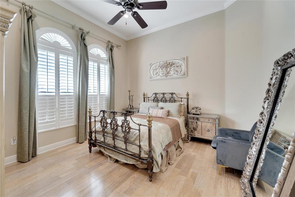 15101 Kestrelglen Way Lithia, FL 33547 - Photo 56 of 75 a bed room with a bed and a chandelier