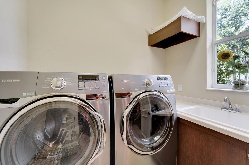 15101 Kestrelglen Way Lithia, FL 33547 - Photo 61 of 75 a utility room with dryer and washer