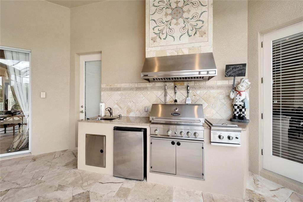 15101 Kestrelglen Way Lithia, FL 33547 - Photo 10 of 75 a kitchen with a stove and a sink