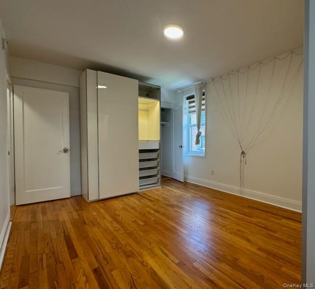 35-40 75th Street, Unit 3B Queens, NY 11372 - Photo 5 of 6 Bedroom featuring light wood finished floors 2 custom built closets with LED +additional built-in storage closet
