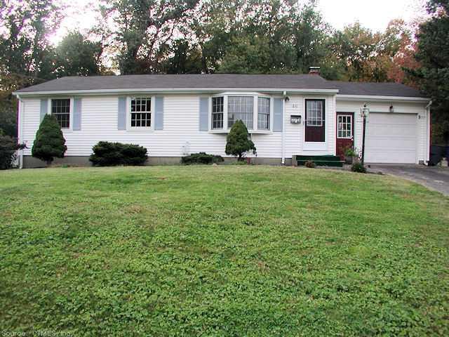 a view of a house with a backyard