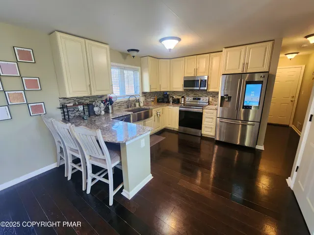 a white toilet sitting next to a bathroom sink