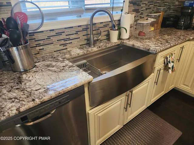 a bedroom with a large bed and a tv