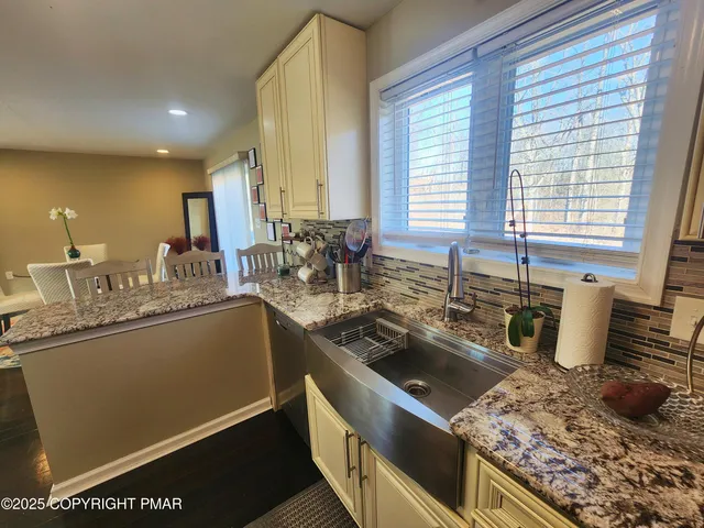 a bedroom with bed and tv