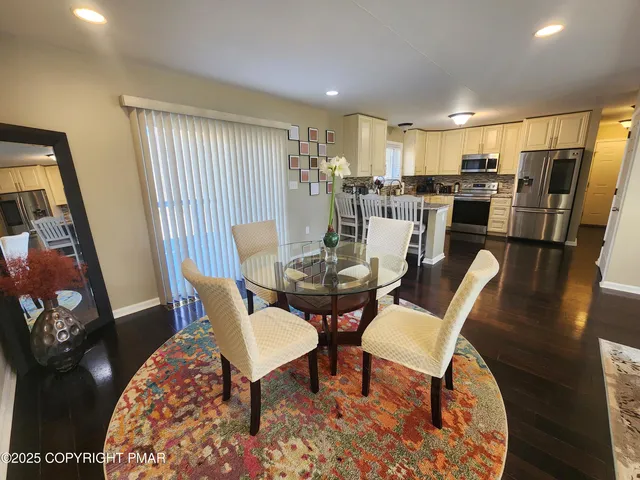 a bedroom with two beds and a television