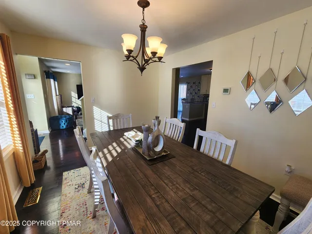 a bathroom with a sink a toilet a mirror a vanity and shower