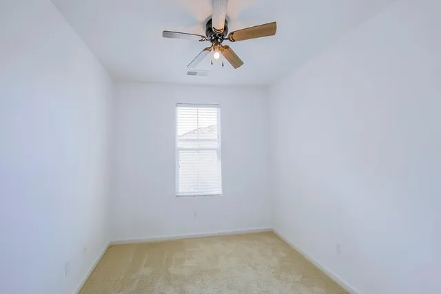 a bathroom with a sink a toilet a mirror and shower