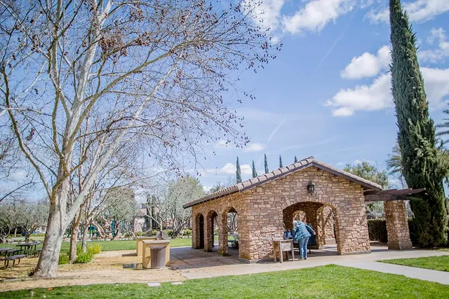 a view of a patio with table and chairs potted plants with floor to ceiling window and floor to ceiling window