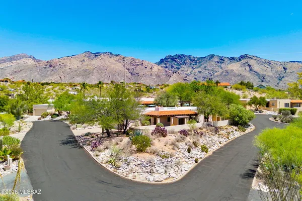 an aerial view of a house with a garden