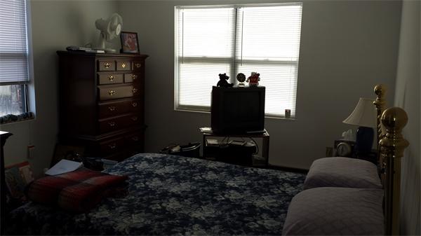 10 Wrentham Road, Unit 207 Worcester, MA 01602 - Photo 8 of 13 a living room with furniture and a floor to ceiling window