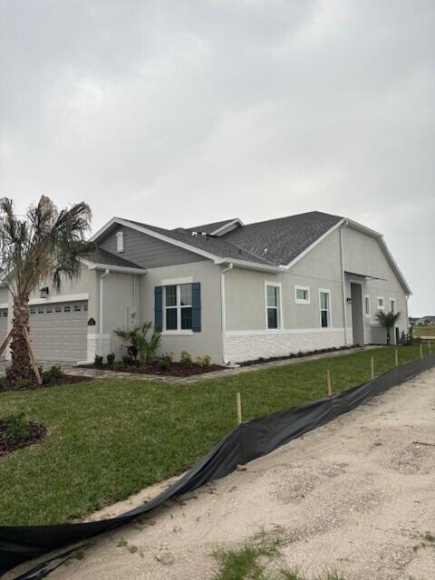 3110 Avalonia Drive Melbourne, FL 32940 - Photo 7 of 8 a front view of a house with a yard