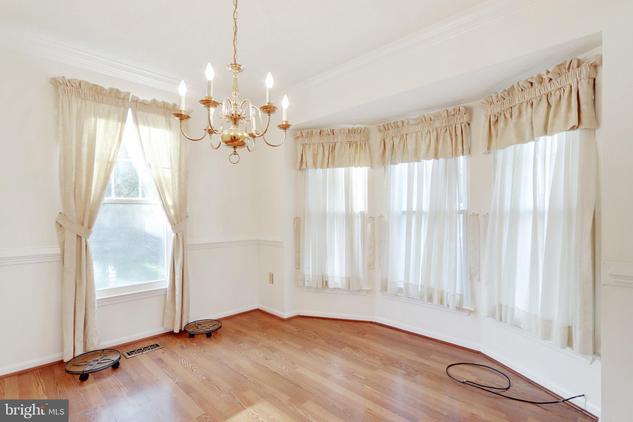 6678 Slacks Road Eldersburg, MD 21784 - Photo 5 of 42 Dining Room adjacent to Living Room w/ Hardwood