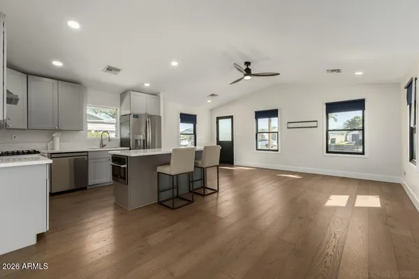 a view of kitchen with sink and living room