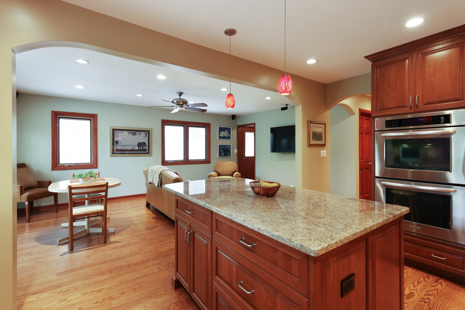 1762 Birch Road Northbrook, IL 60062 - Photo 5 of 19 a kitchen with granite countertop a stove cabinets and wooden floor
