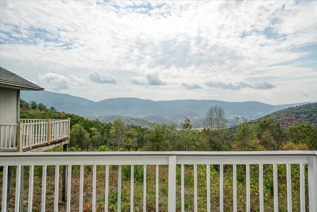 a view of deck with wooden floor and fence