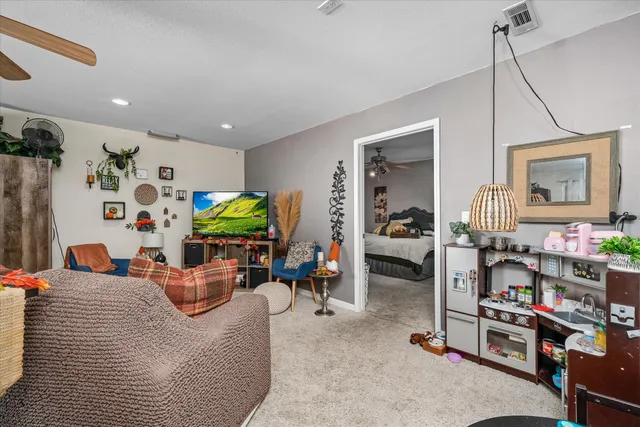 a backyard of a house with table and chairs