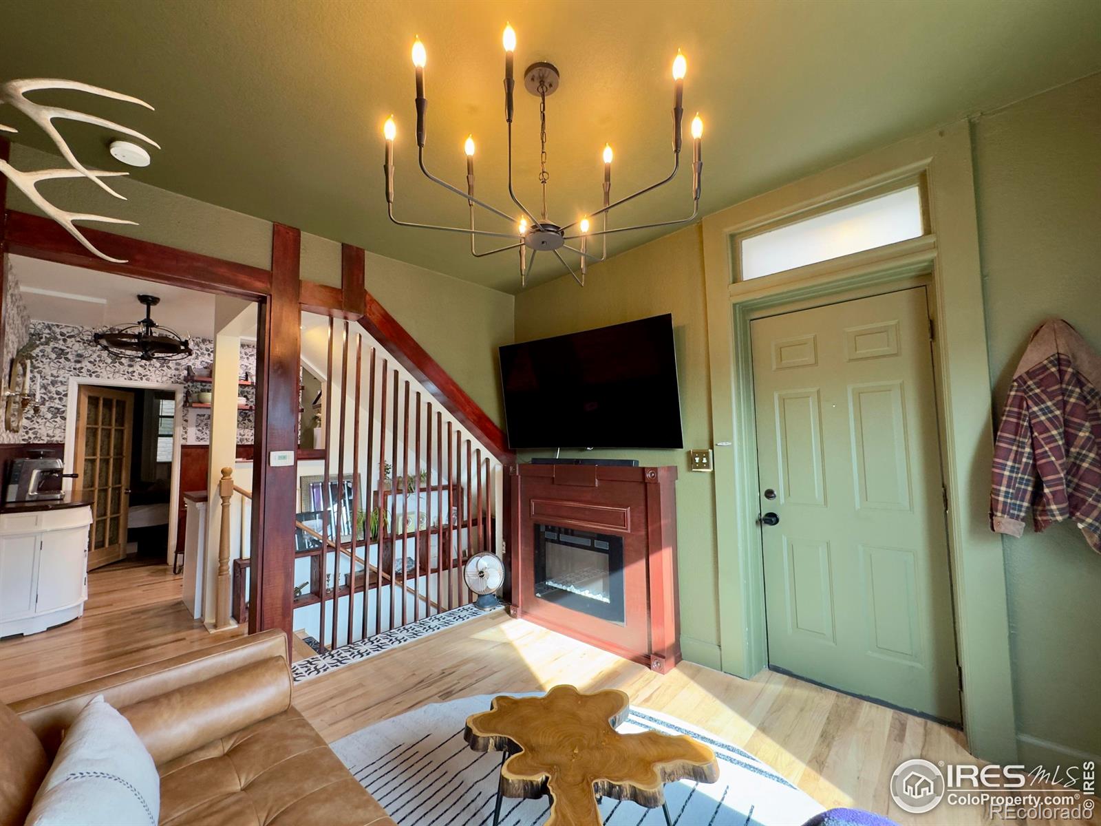 610 Logan Street, Unit 7 Denver, CO 80203 - Photo 1 of 19 a view of a livingroom with furniture and staircase