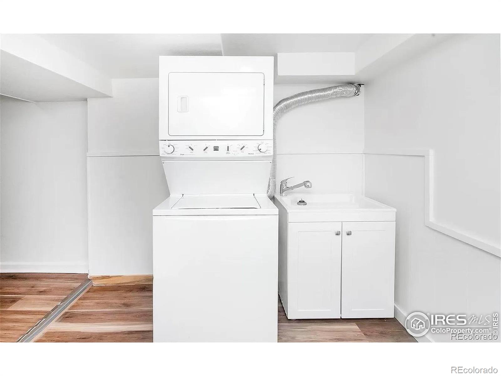 610 Logan Street, Unit 7 Denver, CO 80203 - Photo 17 of 19 a utility room with dryer and washer