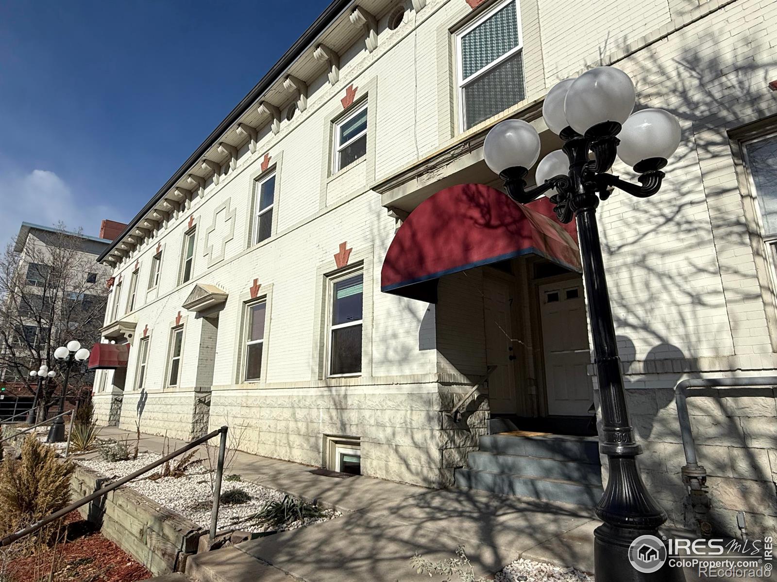 610 Logan Street, Unit 7 Denver, CO 80203 - Photo 2 of 19 a view of a building with a bench
