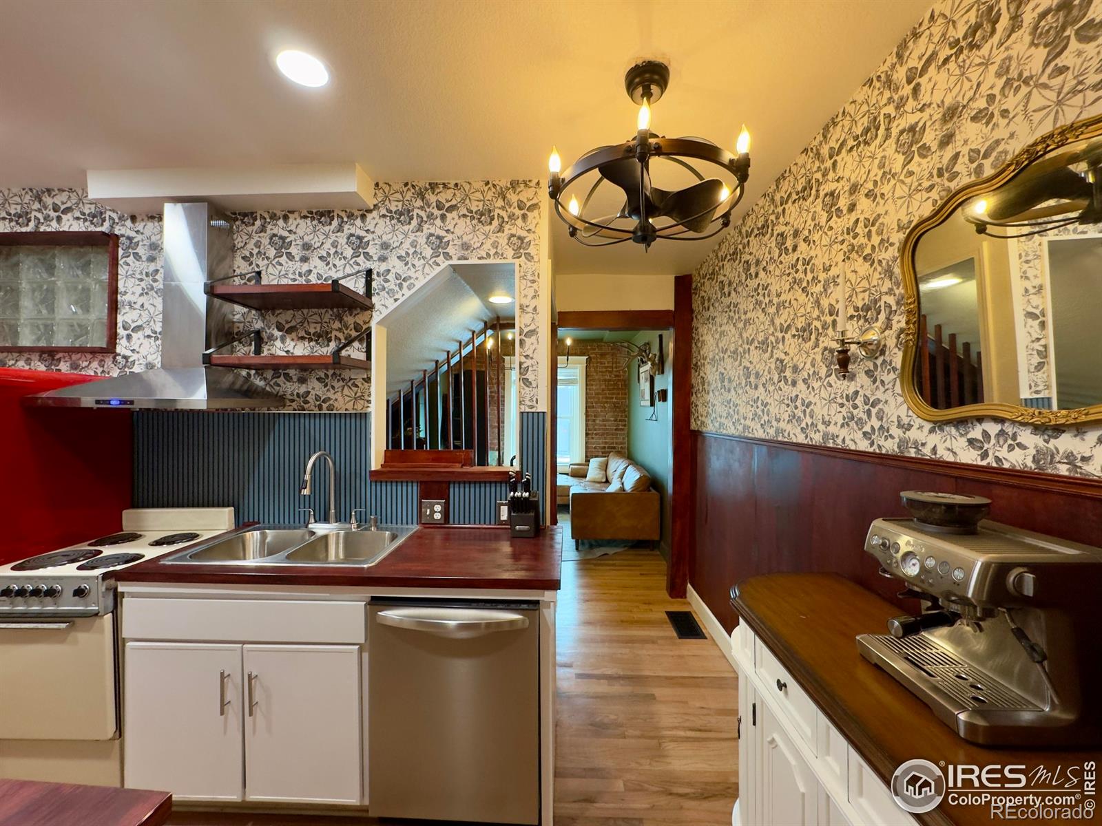 610 Logan Street, Unit 7 Denver, CO 80203 - Photo 6 of 19 a kitchen with a sink and cabinets