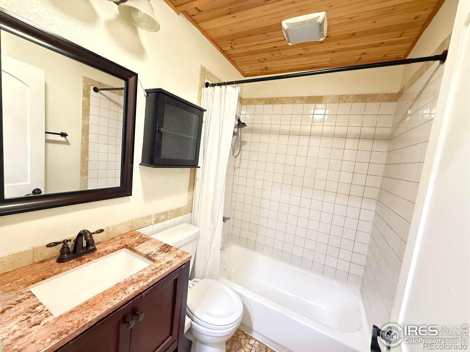 610 Logan Street, Unit 7 Denver, CO 80203 - Photo 10 of 19 a bathroom with a granite countertop sink toilet tub and shower