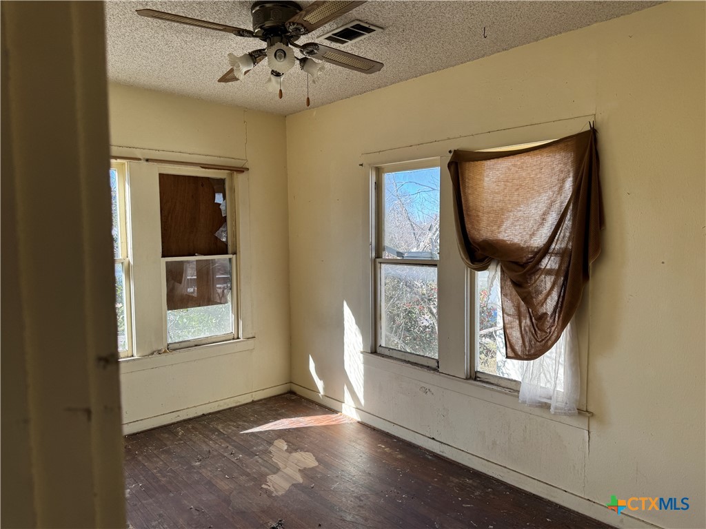 803 North 13th Street Temple, TX 76501 - Photo 14 of 20 an entryway with wooden floor mirror