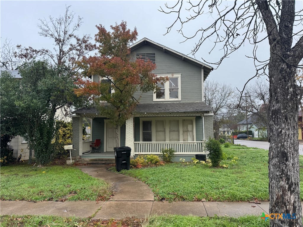 803 North 13th Street Temple, TX 76501 - Photo 2 of 2 a view of a white house with a tree and garden
