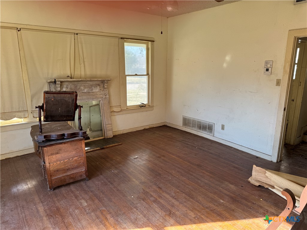 803 North 13th Street Temple, TX 76501 - Photo 3 of 20 a room with wooden floor and a window