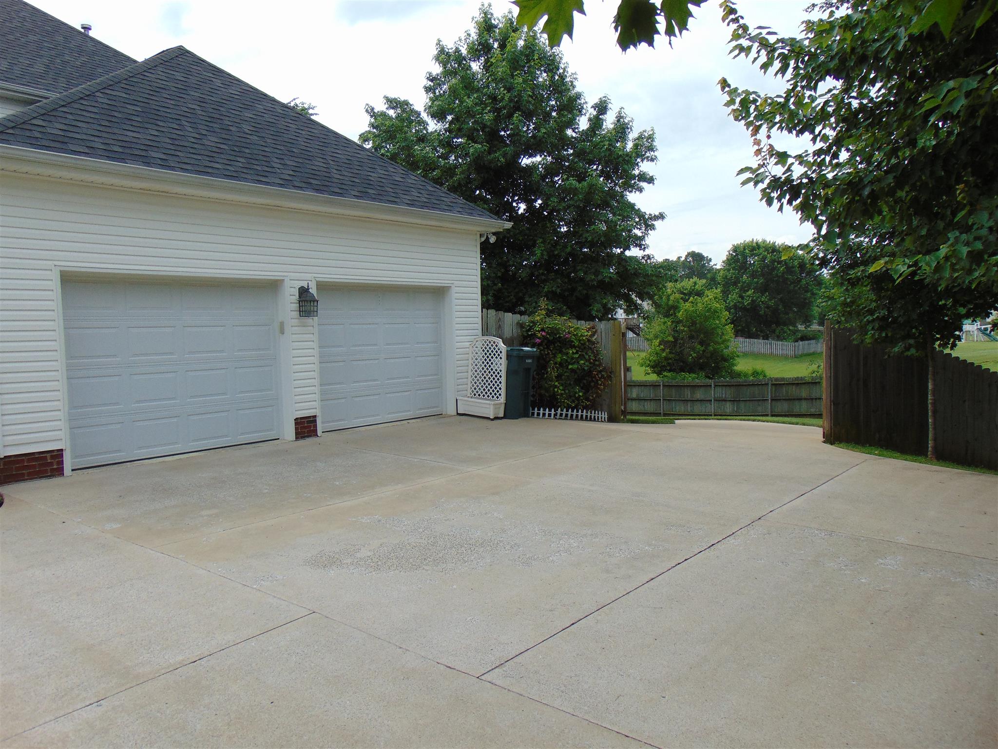 3564 Rabbit Run Trail Adams, TN 37010 - Photo 4 of 30 Extra wide driveway with more than enough room for a few cars, plus the double car garage.