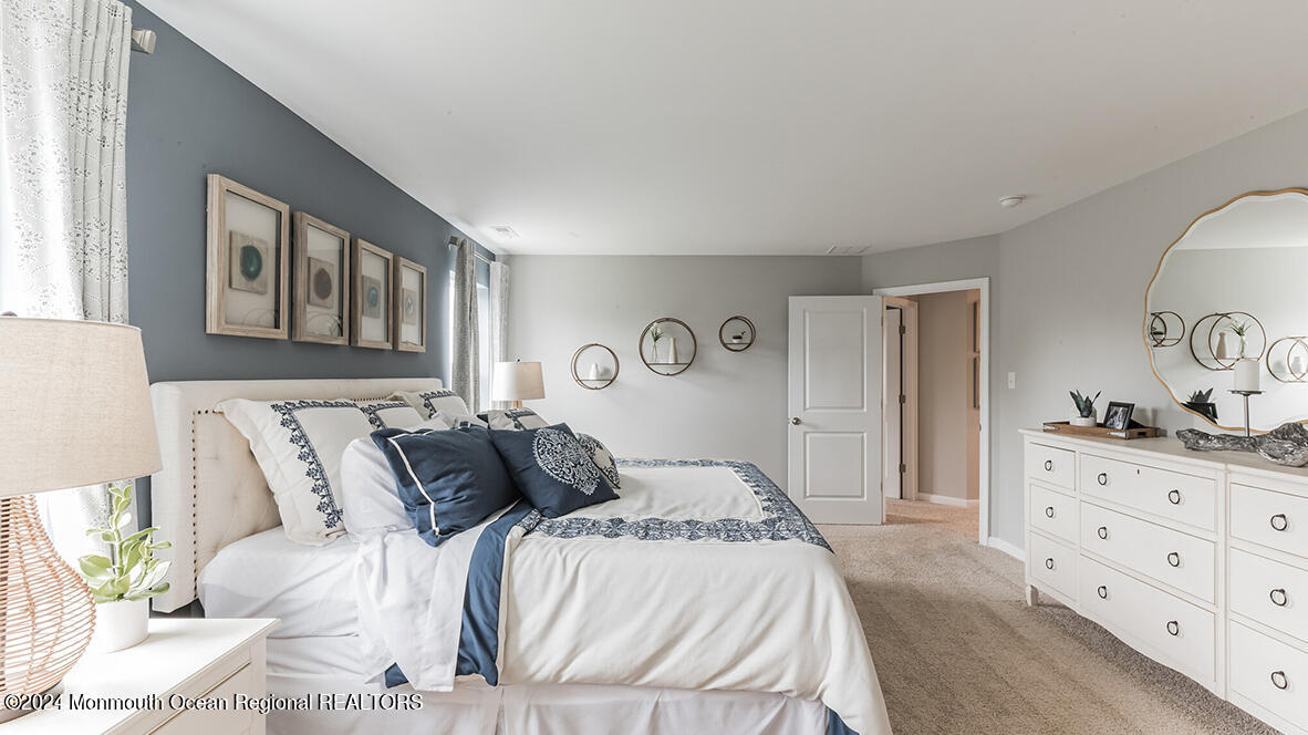 124 West 4th Street Howell, NJ 07731 - Photo 22 of 25 a bedroom with a bed and a dresser