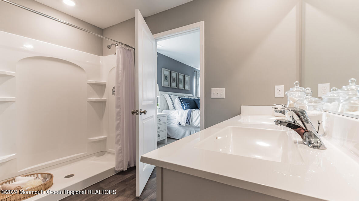 124 West 4th Street Howell, NJ 07731 - Photo 24 of 25 a bathroom with a sink and a mirror