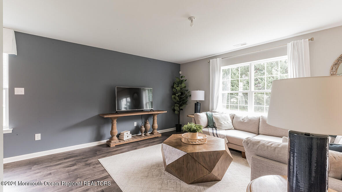124 West 4th Street Howell, NJ 07731 - Photo 6 of 25 a living room with furniture and a flat screen tv