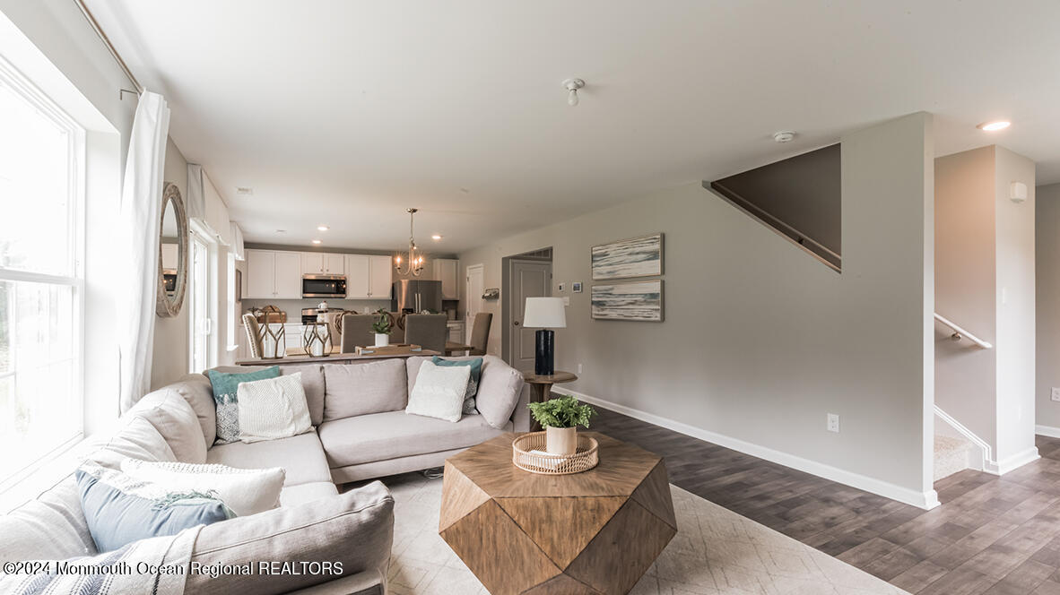 124 West 4th Street Howell, NJ 07731 - Photo 7 of 25 a living room with furniture and a view of kitchen