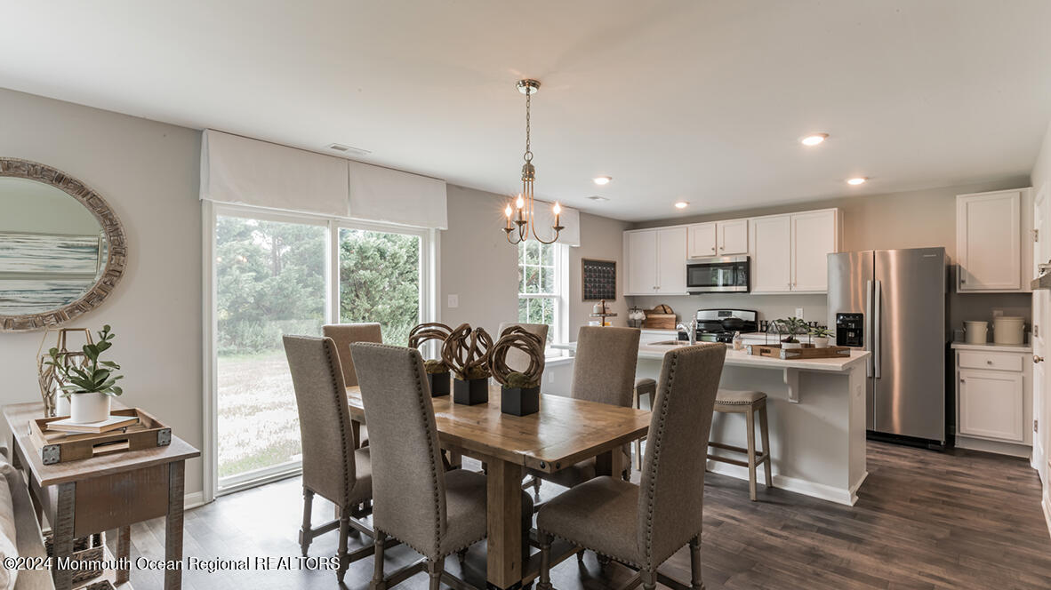 124 West 4th Street Howell, NJ 07731 - Photo 8 of 25 a view of a dining room with furniture window and wooden floor